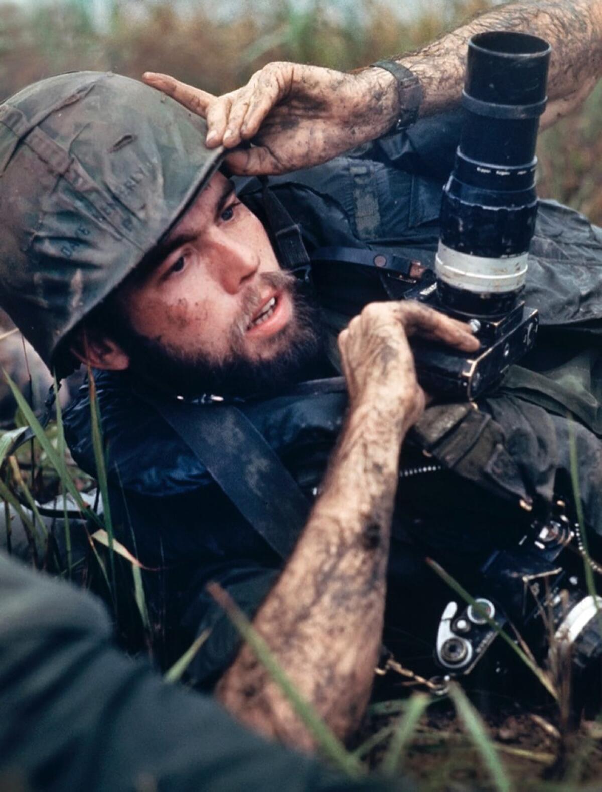 David Hume Kennerly takes cover during a firefight one day after winning the Pulitzer Prize.