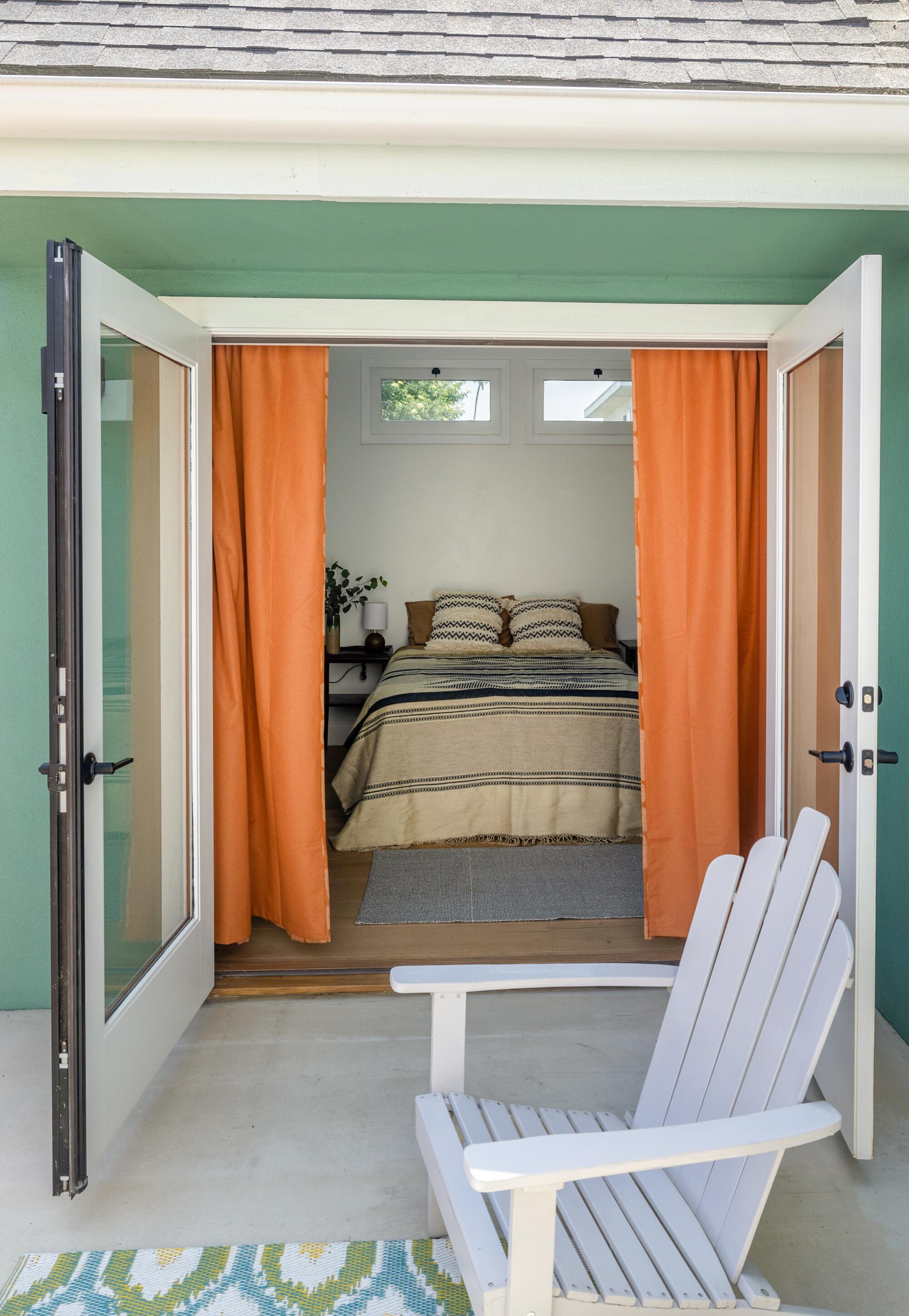 A small patio is located outside a bedroom. 