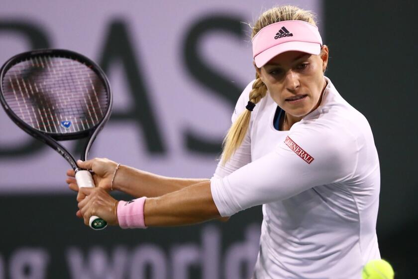 INDIAN WELLS, CALIFORNIA - MARCH 15: Angelique Kerber of Germany plays a backhand against Belinda Bencic of Switzerland during their women's singles semifinal match on day twelve of the BNP Paribas Open at the Indian Wells Tennis Garden on March 15, 2019 in Indian Wells, California. (Photo by Clive Brunskill/Getty Images) ** OUTS - ELSENT, FPG, CM - OUTS * NM, PH, VA if sourced by CT, LA or MoD **