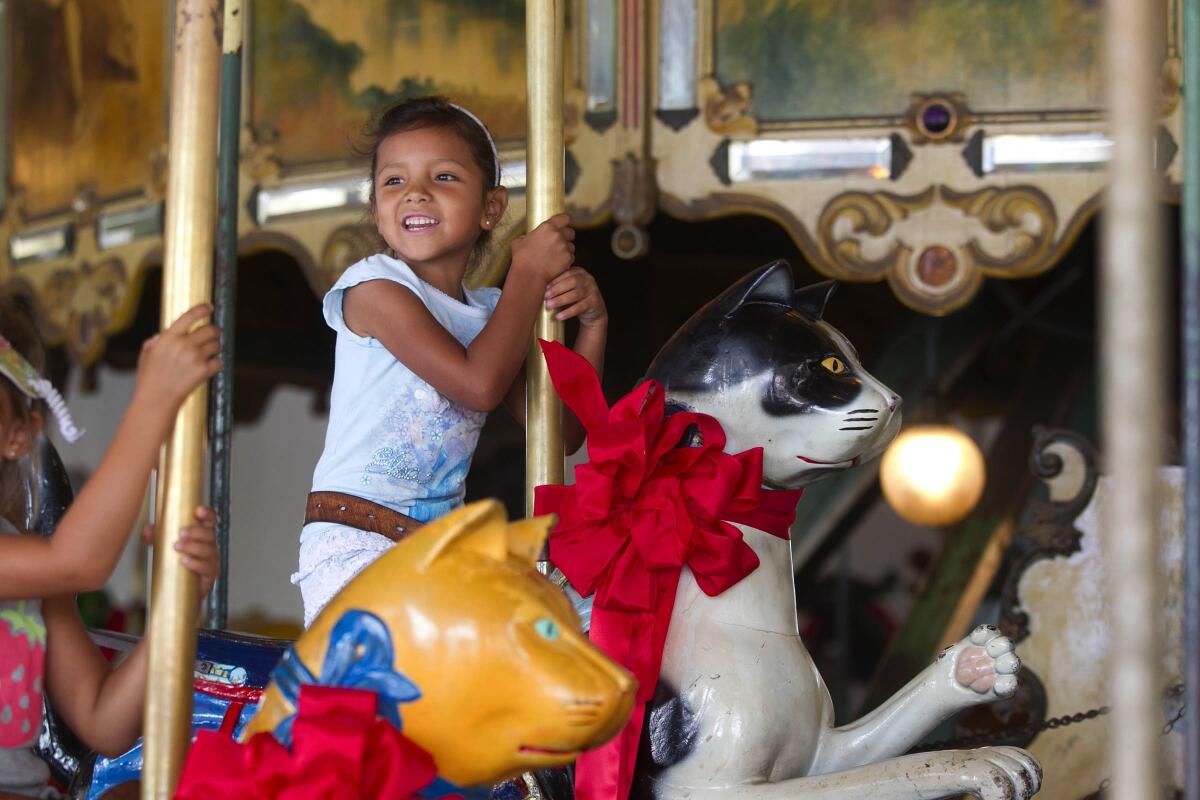 Guests enjoy rides on the historic 1910 Balboa Park Carousel
