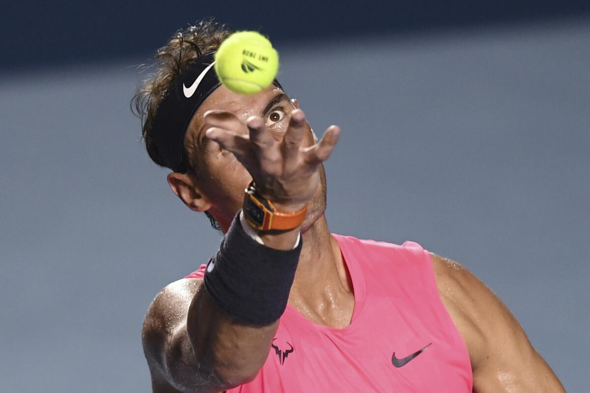 Spain's Rafael Nadal serves the ball to Serbia's Miomir Kecmanovic (out of frame) during their Mexico ATP Open 500 men's singles tennis match in Acapulco, Guerrero State, Mexico, on February 26, 2020. (Photo by PEDRO PARDO / AFP) (Photo by PEDRO PARDO/AFP via Getty Images) ** OUTS - ELSENT, FPG, CM - OUTS * NM, PH, VA if sourced by CT, LA or MoD **
