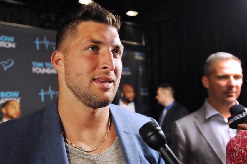 Former NFL quarterback Tim Tebow speaks to reporters at the Tim Tebow Foundation Celebrity Gala and Golf Classic in Ponte Vedra Beach, Fla., on March 13.