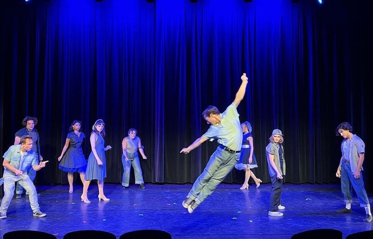 William Lanham, center, leads a dance scene in Teatro San Diego's "West Side Story."