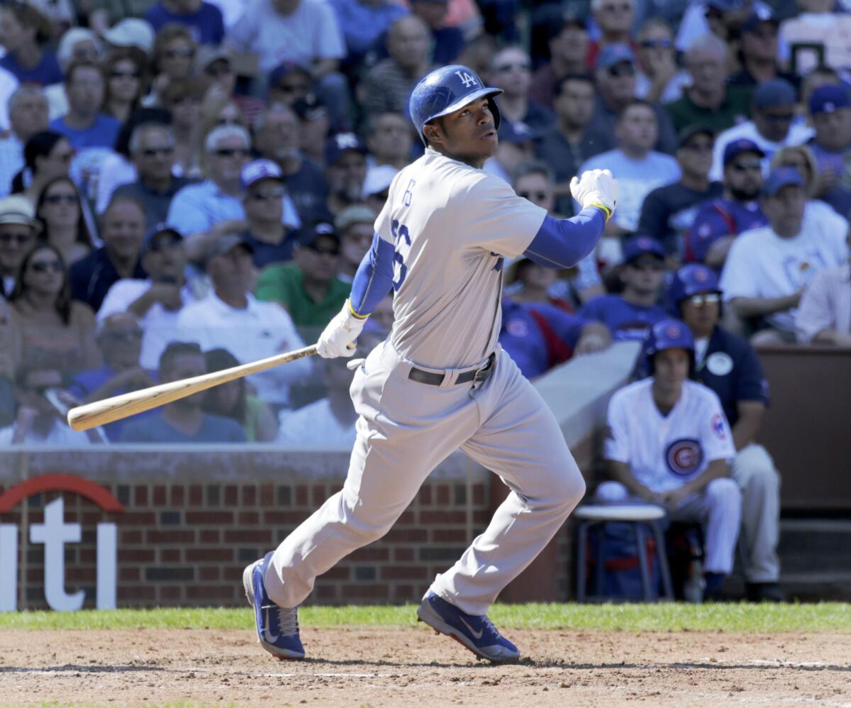 Los Angeles Dodgers' Yasiel Puig doubles off a pitch from Chicago Cubs relief pitcher Eric Jokisch on Sept. 19.