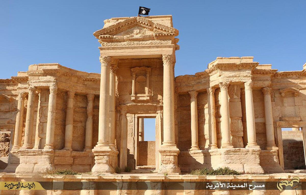 An image made available by Jihadist media outlet Welayat Homs last week allegedly shows the flag of the Islamic State fluttering atop the wall that encircles the Roman theater of the ancient city of Palmyra.