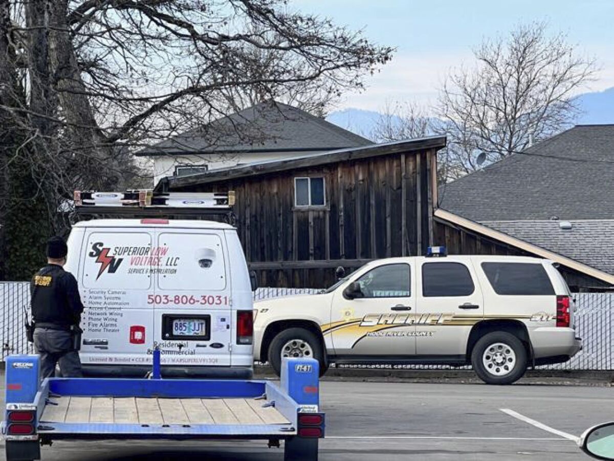Hood River Police respond to an active shooter in Hood River, Ore. on Thursday, Feb. 2, 2023. Police in Oregon said Thursday that a suspect in what they had described as an active shooter situation was "contained in his house," in the small city of Hood River.(Columbia Gorge News via AP)