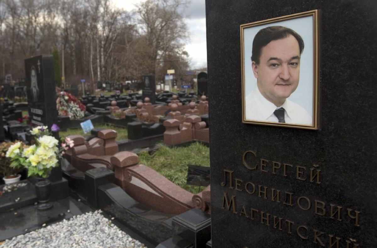 A tombstone on the grave of lawyer Sergei Magnitsky who died in jail, at a cemetery in Moscow, Friday, Nov. 16, 2012. The Magnitsky Act of 2012, a human rights legislation named after Magnitsky, imposes sanctions on Russian officials involved in human rights violations.