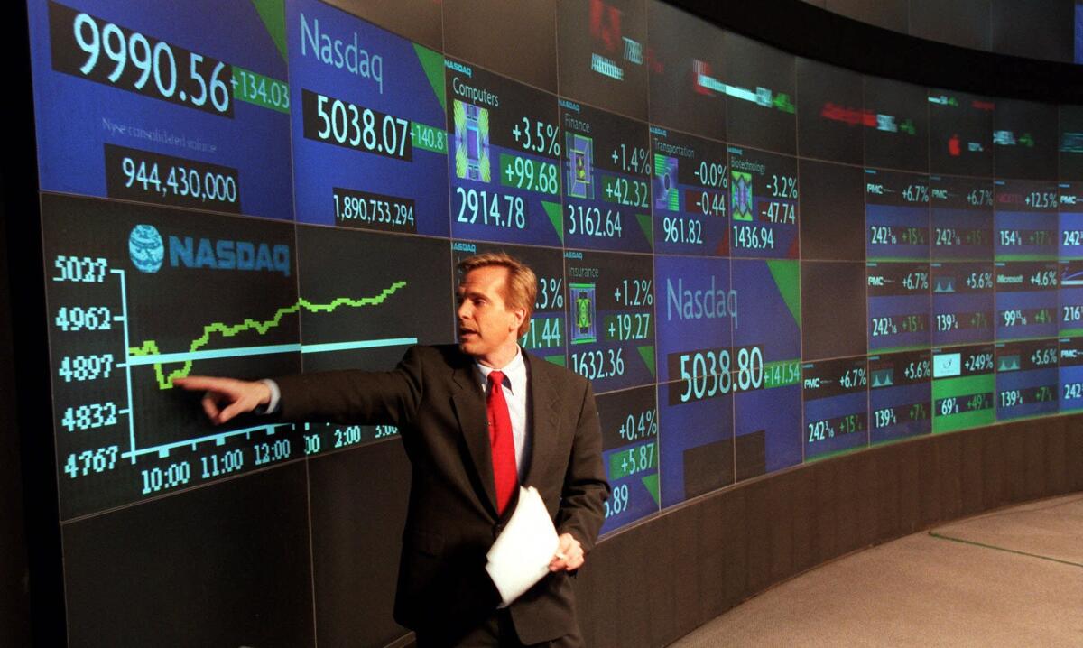 Charles Molineaux delivers a live broadcast from Nasdaq on March 9, 2000, when the index crossed the 5,000 barrier for the first time. A day later it hit another record that wouldn't be broken until April 23, 2015.