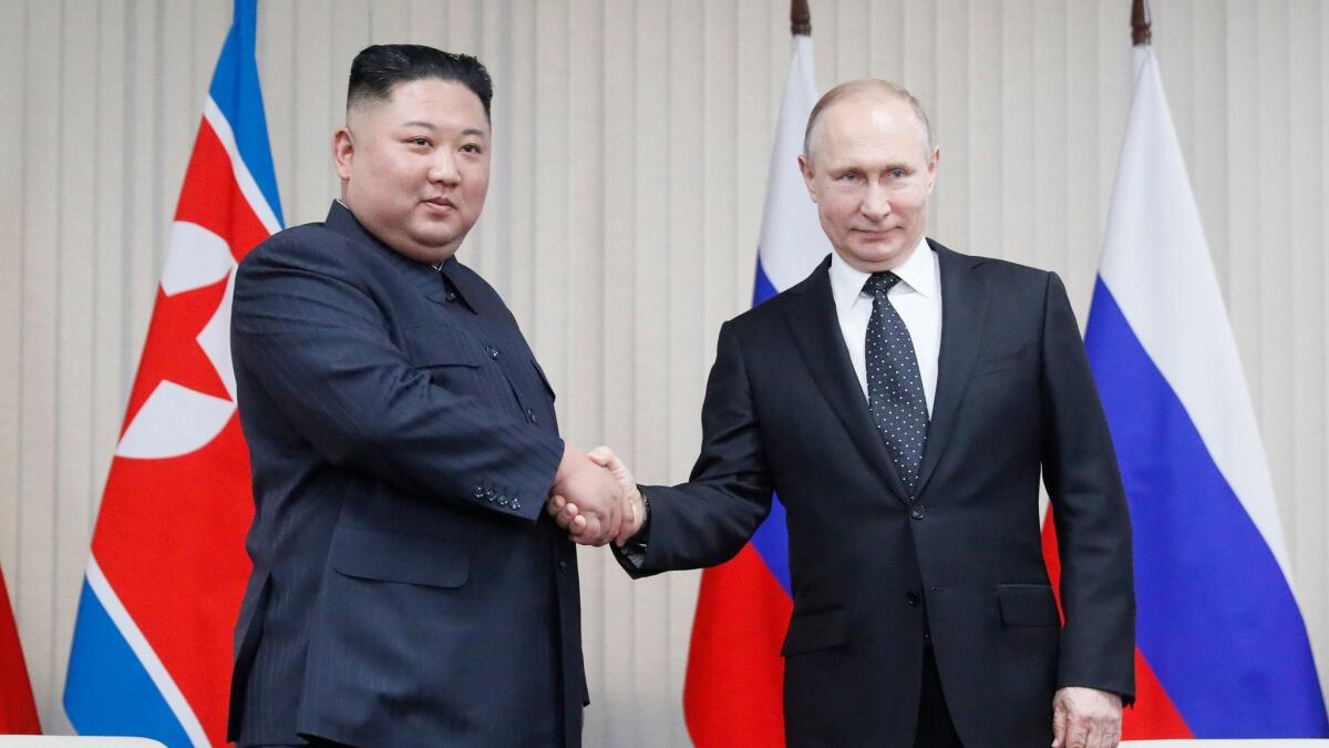 Russian President Vladimir Putin, right, and North Korean leader Kim Jong Un during their meeting at the Far East Federal University in Vladivostok, Russia, on Thursday.