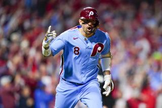 Philadelphia Phillies' Nick Castellanos reacts after hitting a home run during the sixth inning of Game 4 of a baseball NL Division Series against the Atlanta Braves Thursday, Oct. 12, 2023, in Philadelphia.(AP Photo/Chris Szagola)
