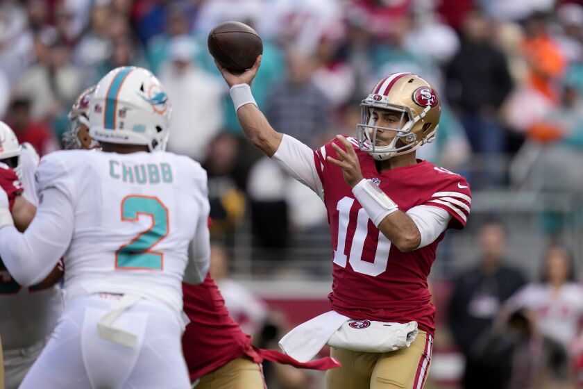 San Francisco 49ers quarterback Jimmy Garoppolo (10) passes against the Miami Dolphins during the first half of an NFL football game in Santa Clara, Calif., Sunday, Dec. 4, 2022. (AP Photo/Godofredo A. Vásquez)