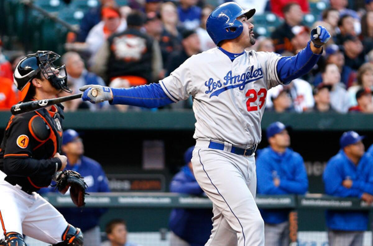 Dodgers first baseman Adrian Gonzalez watches his fly ball that drove in Carl Crawford for the team's only run against the Orioles in the second game of a doubleheader Saturday night in Baltimore.