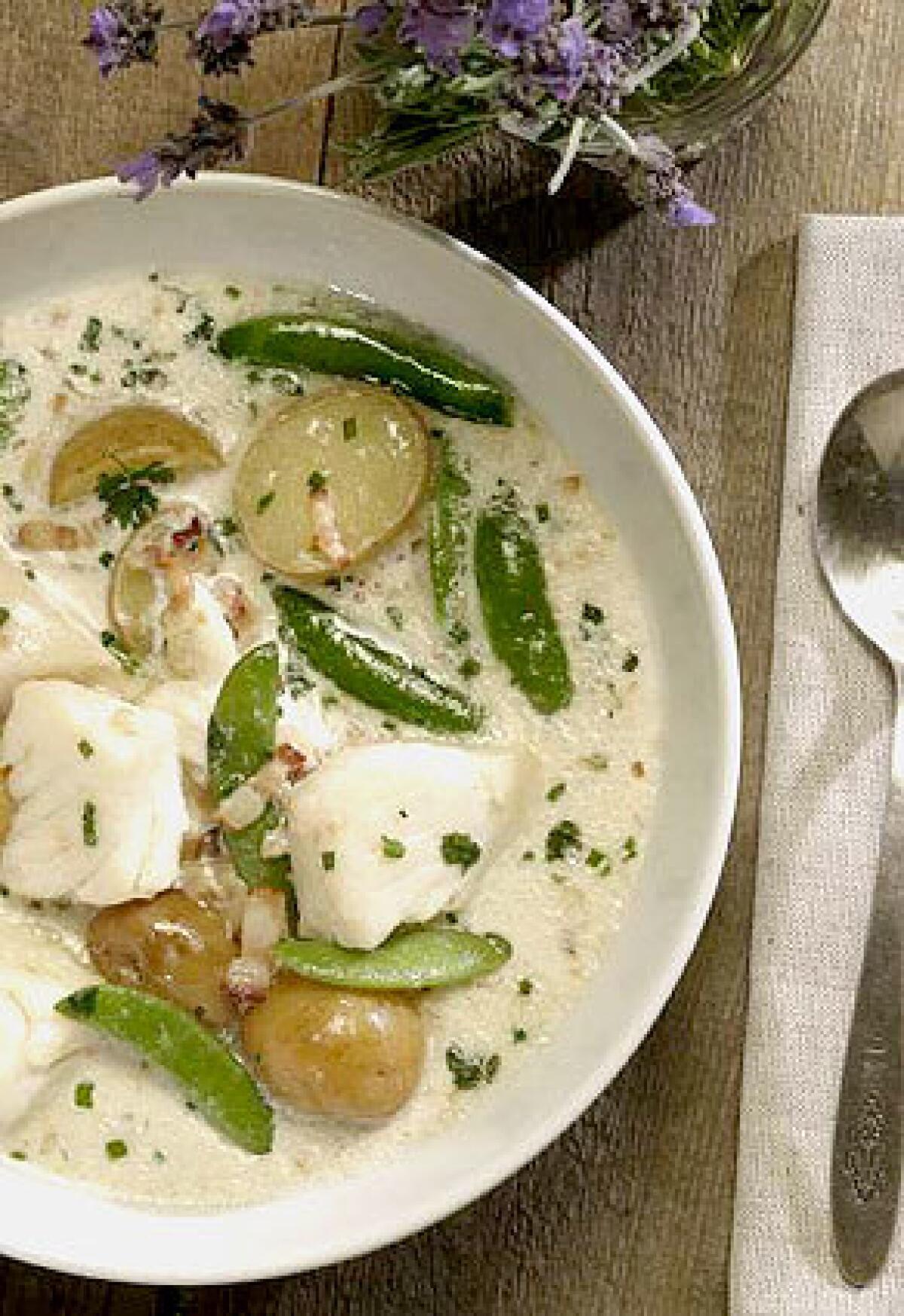 A BRIGHT BOWLFUL: For halibut chowder, start with a creamy base and add in potatoes, sugar snap peas, bacon and herbs to create a savory blend.