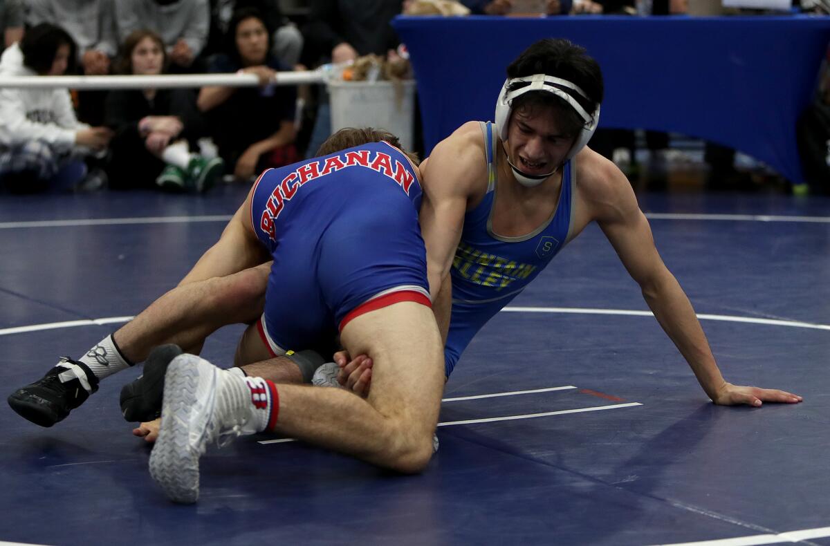 Fountain Valley's Sean Solis wrestles Buchanan's Jack Gioffre in the 132-pound final of the Five Counties Tournament.