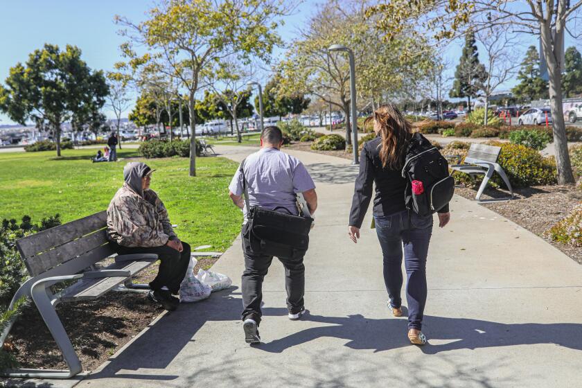 SAN DIEGO, CA-FEB.27: Michele Padilla, a Psychiatric Mental Health nurse, and Michelle LeFlever walk near the Embardadero to a mental health session with a homeless person in San Diego on Monday, February 27, 2023 (Photo by Sandy Huffaker for The San Diego Union Tribune)