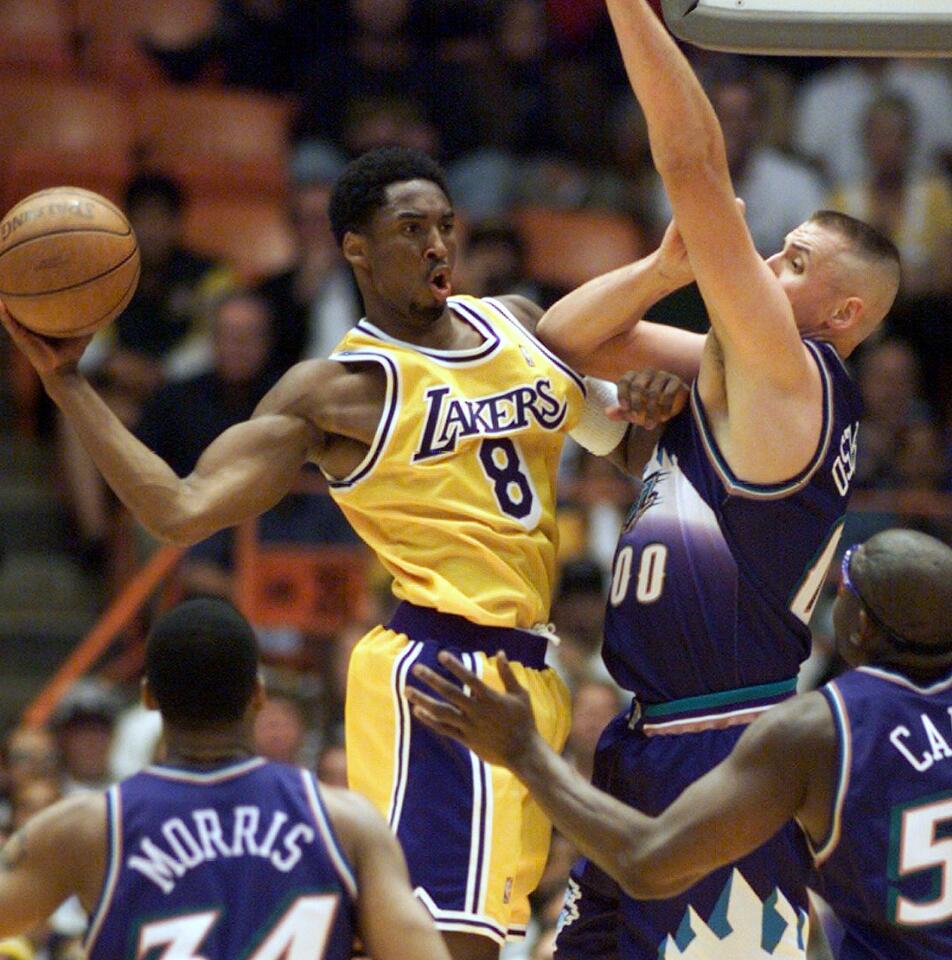 Kobe Bryant drives against Utah center Greg Ostertag.