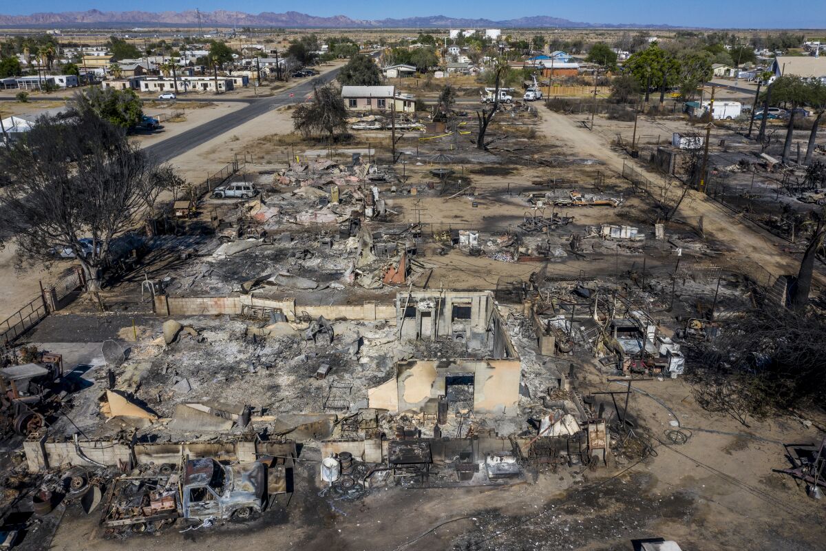 Seen from above, blocks of homes on Third Street lay in ashes the day after high winds stoked a wildfire