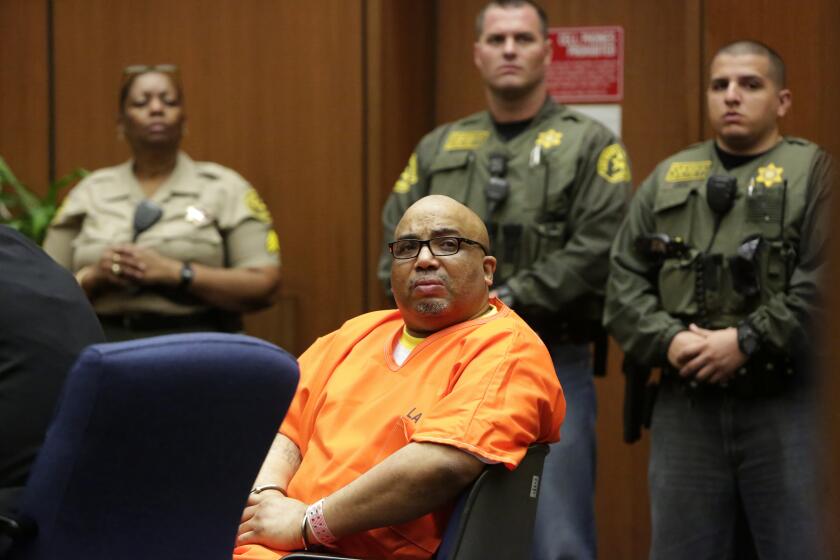 LOS ANGELES, CA. AUGUST 01, 2014 --- Chester D. Turner, in orange, listens to a victim's family member statement prior to his sentencing. Turner, a convicted serial killer who was already sentenced to death seven years ago for murdering 10 women, was sentenced to death on Friday August 01, 2014 for killing four others in the Los Angeles area between 1987 and 1997. In handing down the sentence, Los Angeles Superior Court Judge Robert J. Perry went along with the jury's June 26 recommendation of a death sentence for Turner, who has been called one of the Southland's most prolific serial killers. (Irfan Khan / Los Angeles Times)