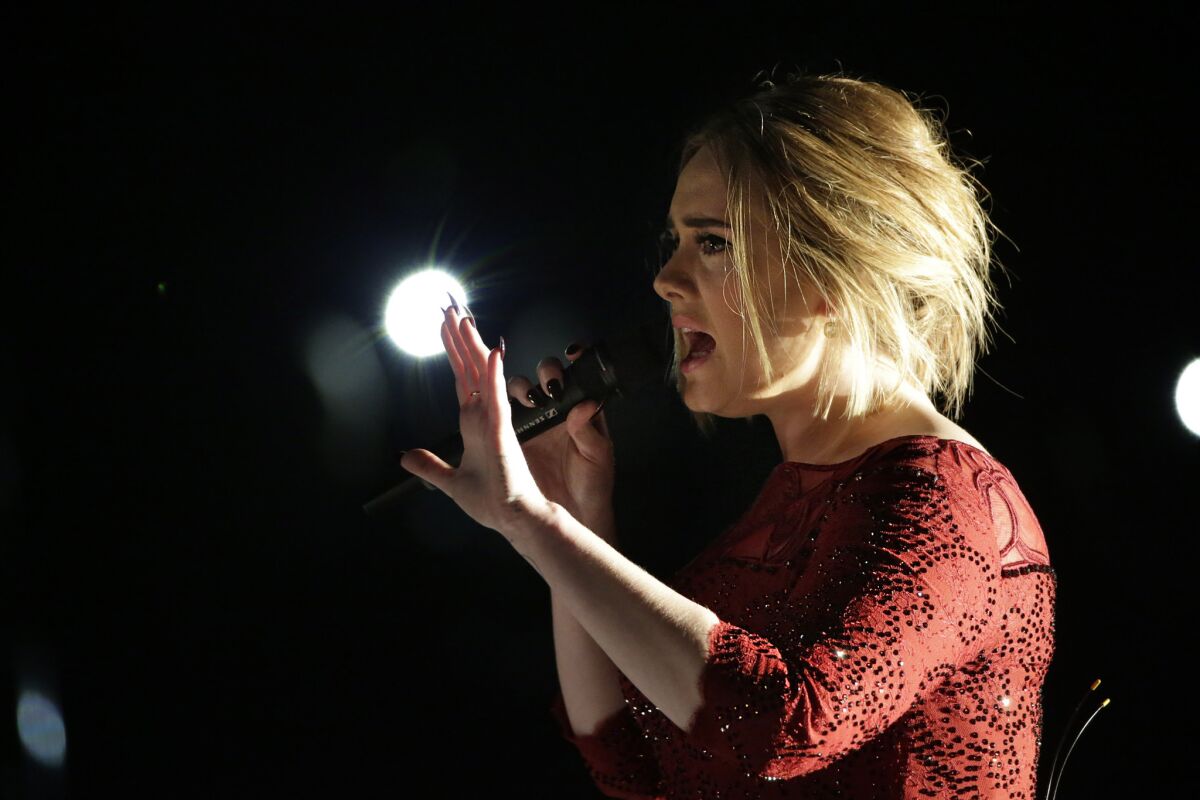 Adele performs at the 58th Grammy Awards in Los Angeles.