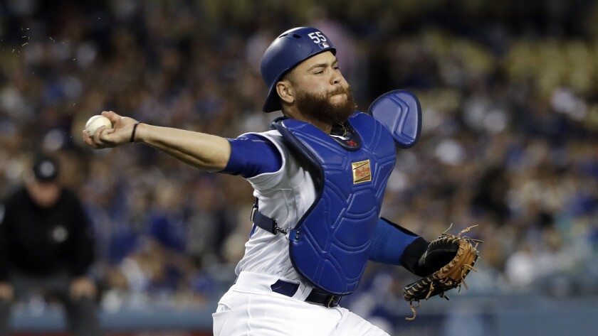 Dodgers catcher Russell Martin throws during a game against the Arizona Diamondbacks on March 30.