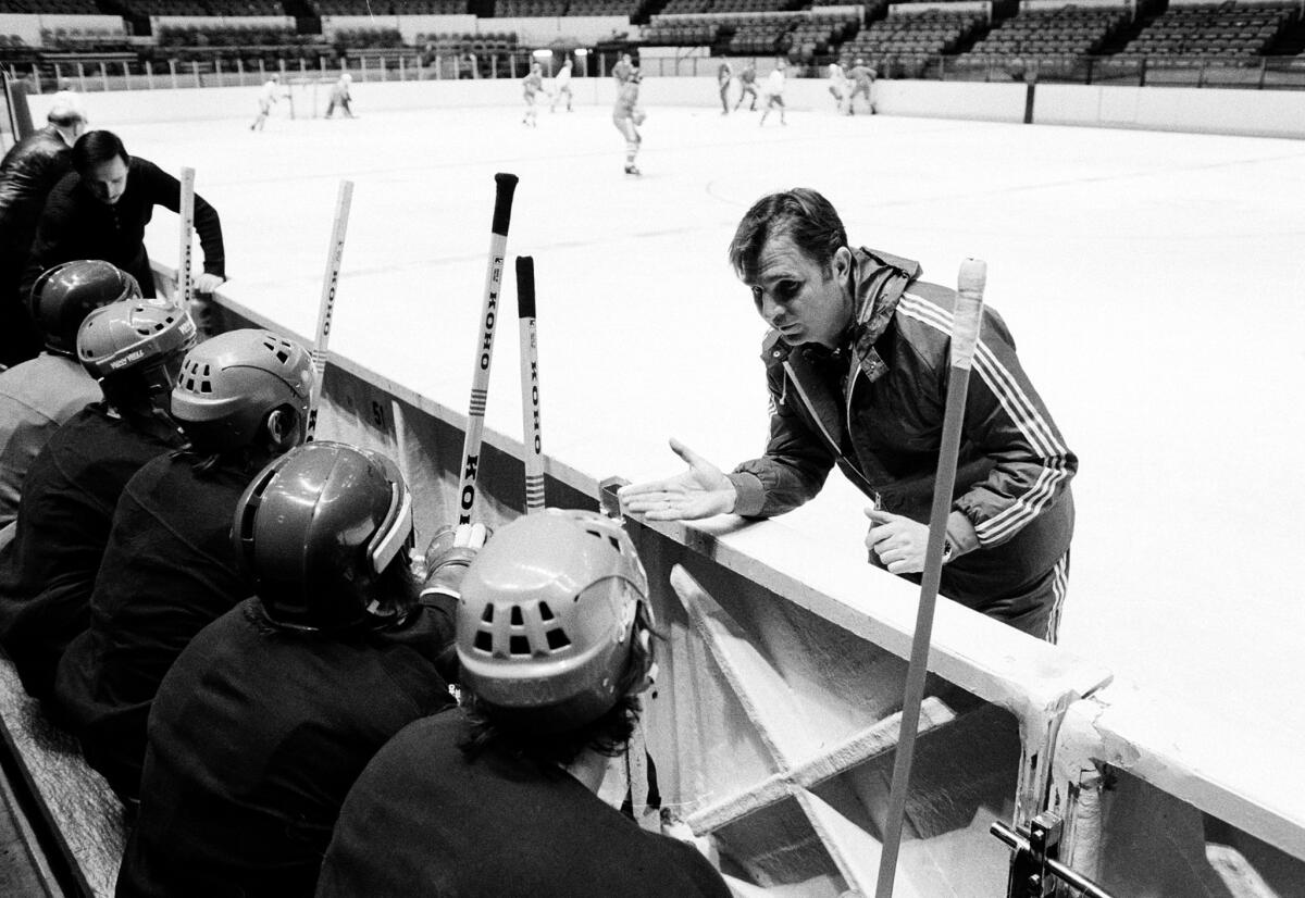 Victor Tikhonov, right, coaches the Soviet National Hockey team in 1979. The legendary Russian hockey coach, whose teams won three Olympic gold medals, died after a long illness. He was 84.