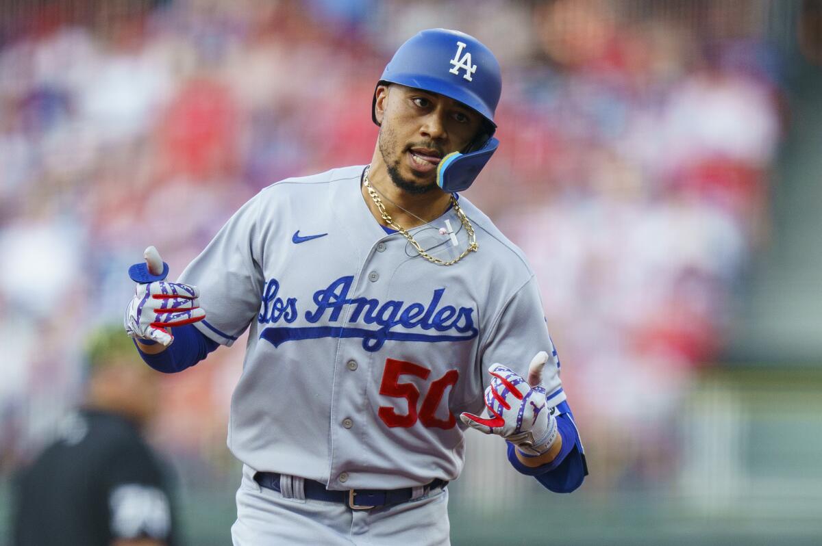 The Dodgers' Mookie Betts celebrates after hitting a solo homer against the Philadelphia Phillies in the third inning.