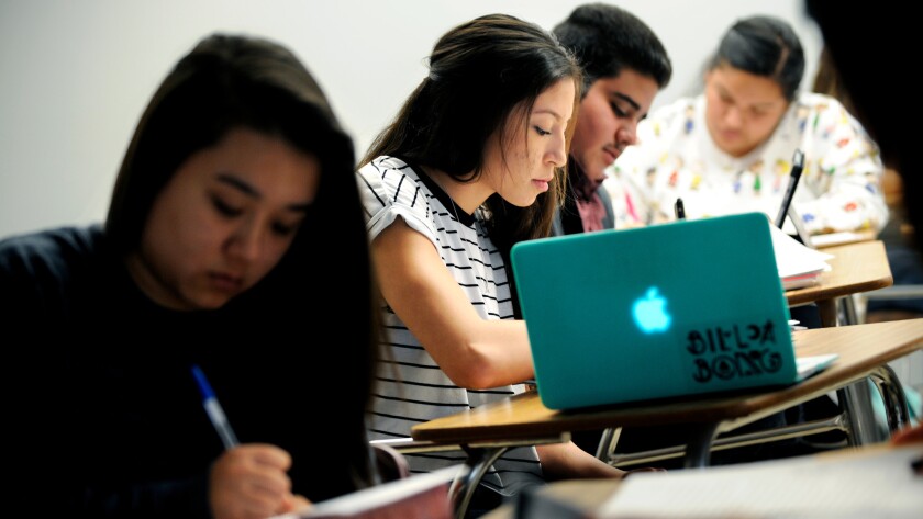 College freshmen study in a class that is part of the freshman First-Year Experience, designed to help students stay in school, at Cal State Dominguez Hills in October 2015.