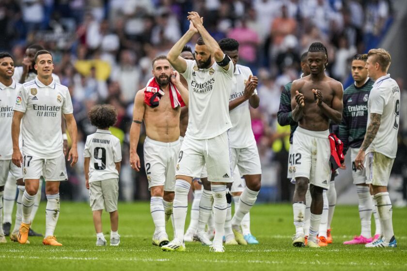 Real Madrid's Karim Benzema claps to supporters after the Spanish La Liga soccer match against Athletic Bilbao at the Santiago Bernabeu stadium in Madrid, Sunday, June 4, 2023. (AP Photo/Bernat Armangue)