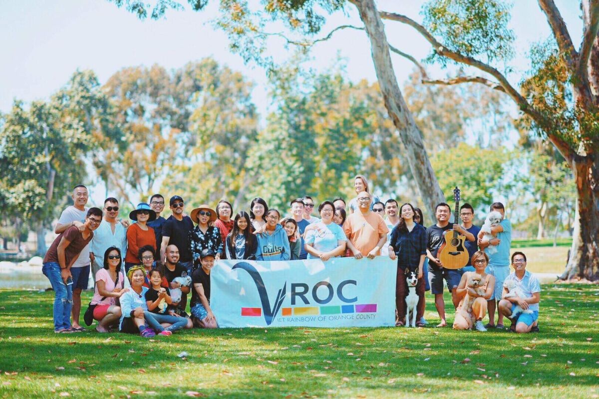 A table with members of Viet Rainbow of Orange County (VROC).