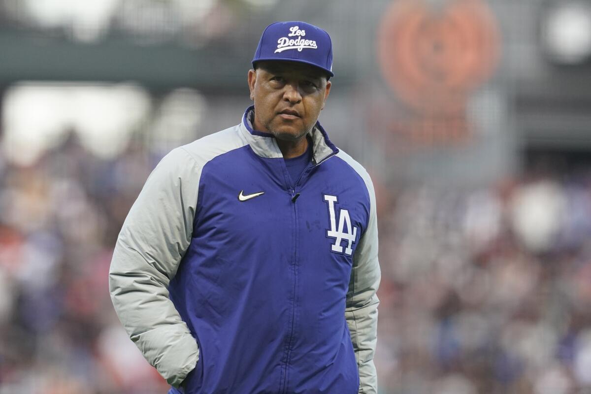 Los Angeles Dodgers manager Dave Roberts (30) looks on before the first  inning of a baseball