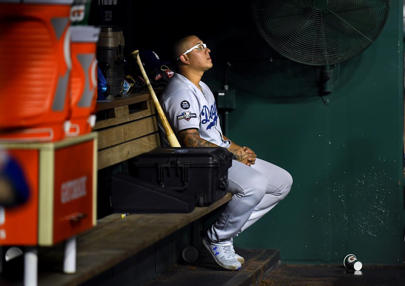 WASHINGTON D.C., OCTOBER 7, 2019-Dodgers relief pitcher Julio Urias sits in the dugout alone after giving up three runs against the Nationals in Game 4 of the NLDS at Nationals Stadium Monday. (Wally Skalij/Los Angeles Times)