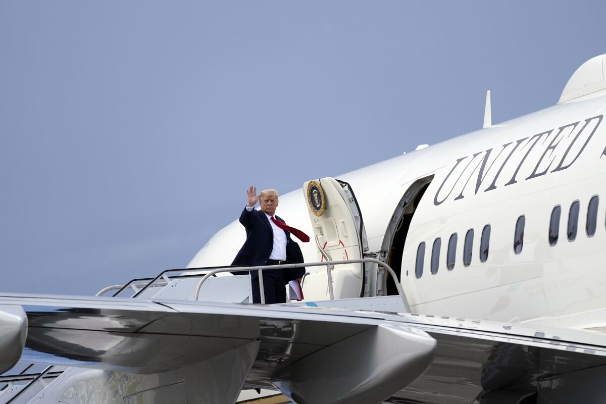President Donald Trump waves as he leaves at West Palm Beach International Airport, Tuesday, Sept. 8, 2020, in West Palm Beach, Fla. (AP Photo/Evan Vucci)