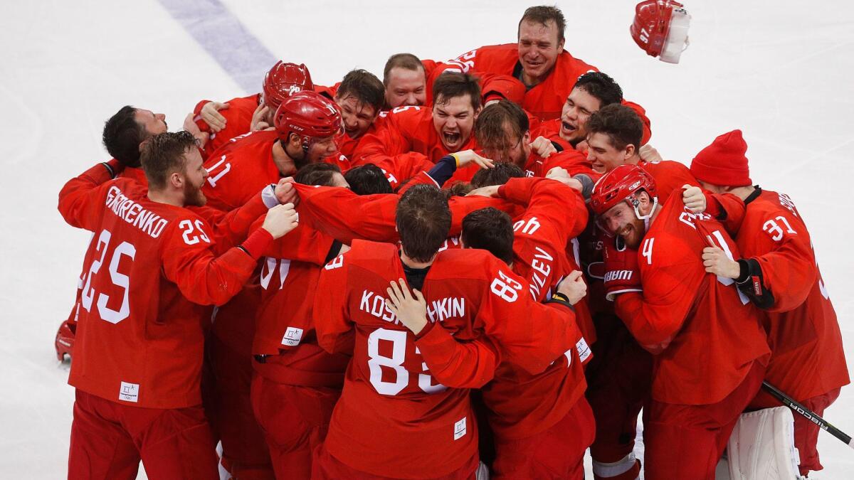 Olympic Athletes From Russia celebrate after winning the men's gold medal hockey game against Germany.