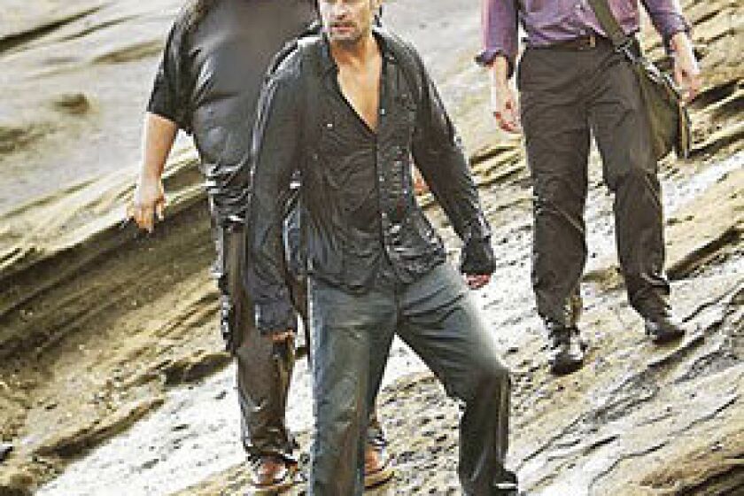Jorge Garcia, left rear, Josh Holloway and Michael Emerson in the last episode of the ABC drama "Lost," which aired Sunday night.
