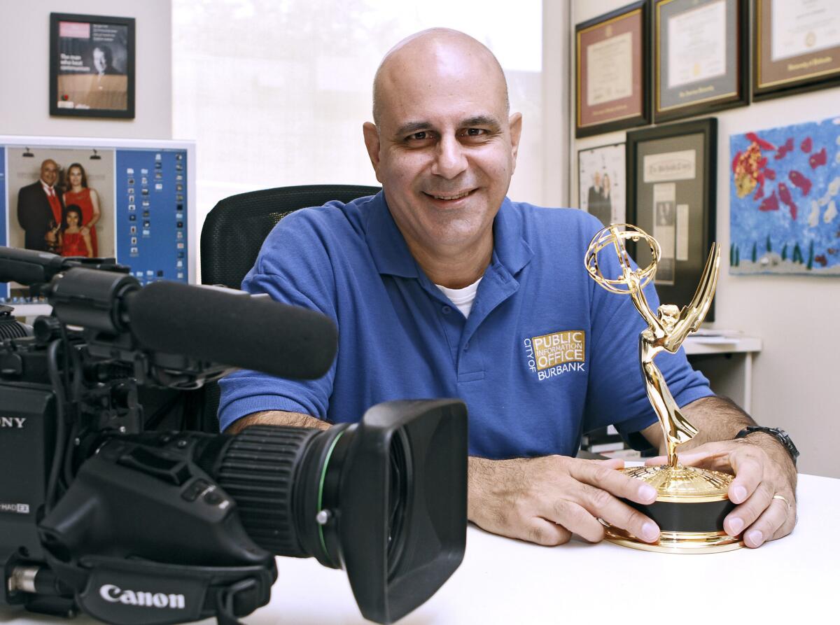 Burbank channel's station manager Peter Mursulian with the Emmy he won recently, at his office in Burbank on Friday, August 9, 2013. Mursulian won the Emmy for a documentary he produced about Burbank's sister city in Botswana.