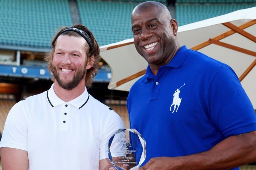 LOS ANGELES, CA - JULY 27: Clayton Kershaw (L) and Magic Johnson at Clayton Kershaw's 5th Annual Ping Pong 4 Purpose Celebrity Tournament at Dodger Stadium on July 27, 2017 in Los Angeles, California. (Photo by Leon Bennett/Getty Images for Kershaw's Challenge ) ** OUTS - ELSENT, FPG, CM - OUTS * NM, PH, VA if sourced by CT, LA or MoD **