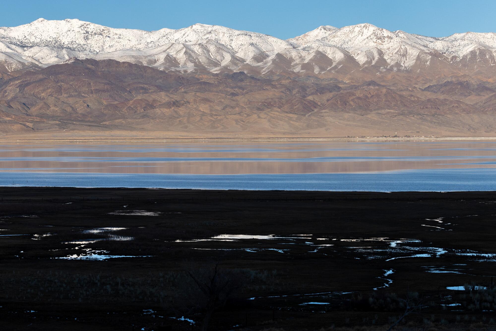 The snow-capped Inyo Mountains reflected in Owens Lake.