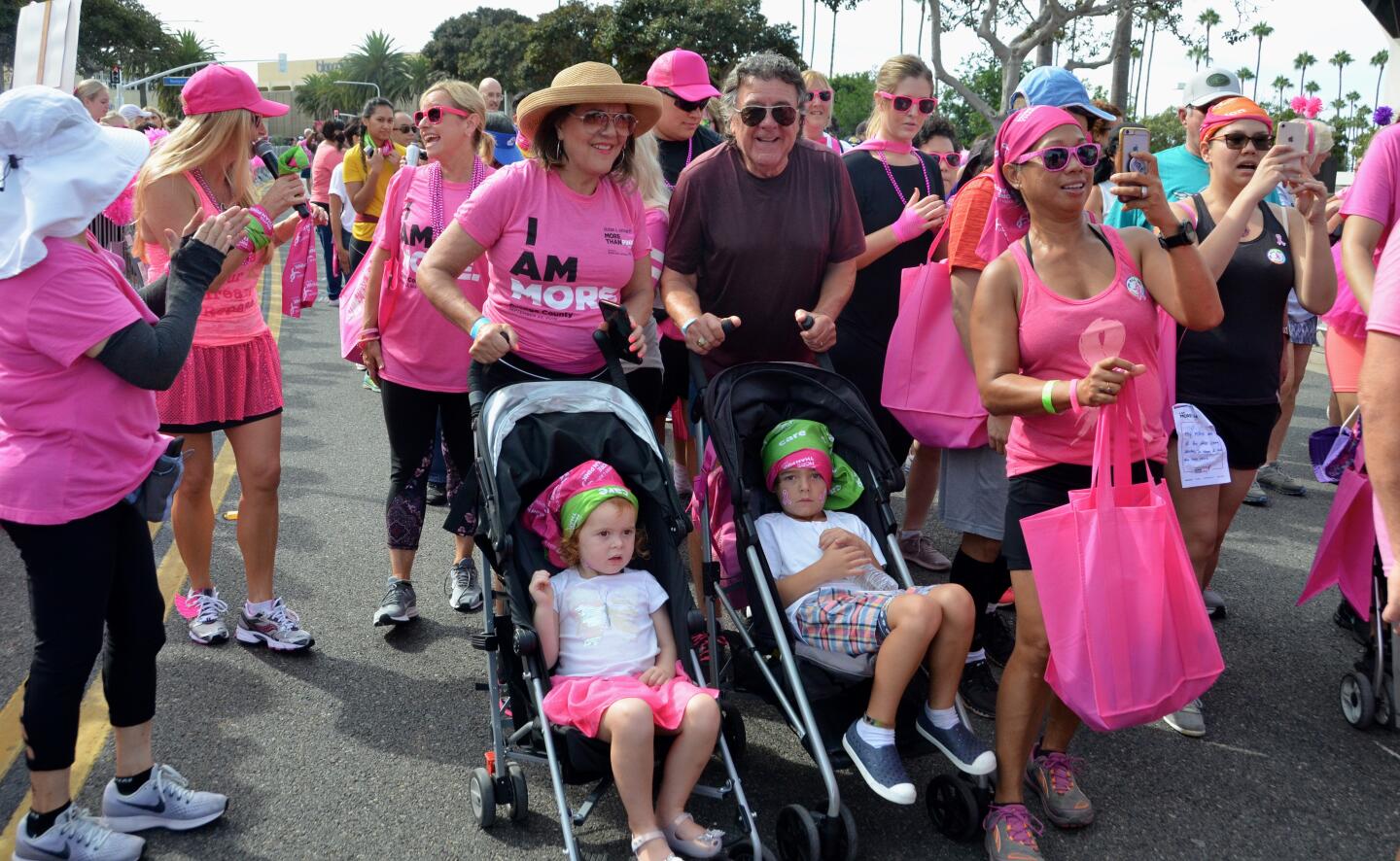 Children in strollers roll out for the More than Pink Walk on Sunday near Fashion Island in Newport Beach.