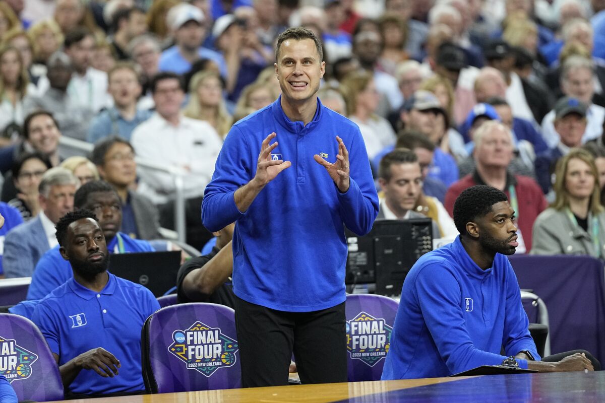 Duke assistant coach Jon Scheyer watches during the first half of a college basketball game in the semifinal round of the Men's Final Four NCAA tournament, Saturday, April 2, 2022, in New Orleans. (AP Photo/David J. Phillip)