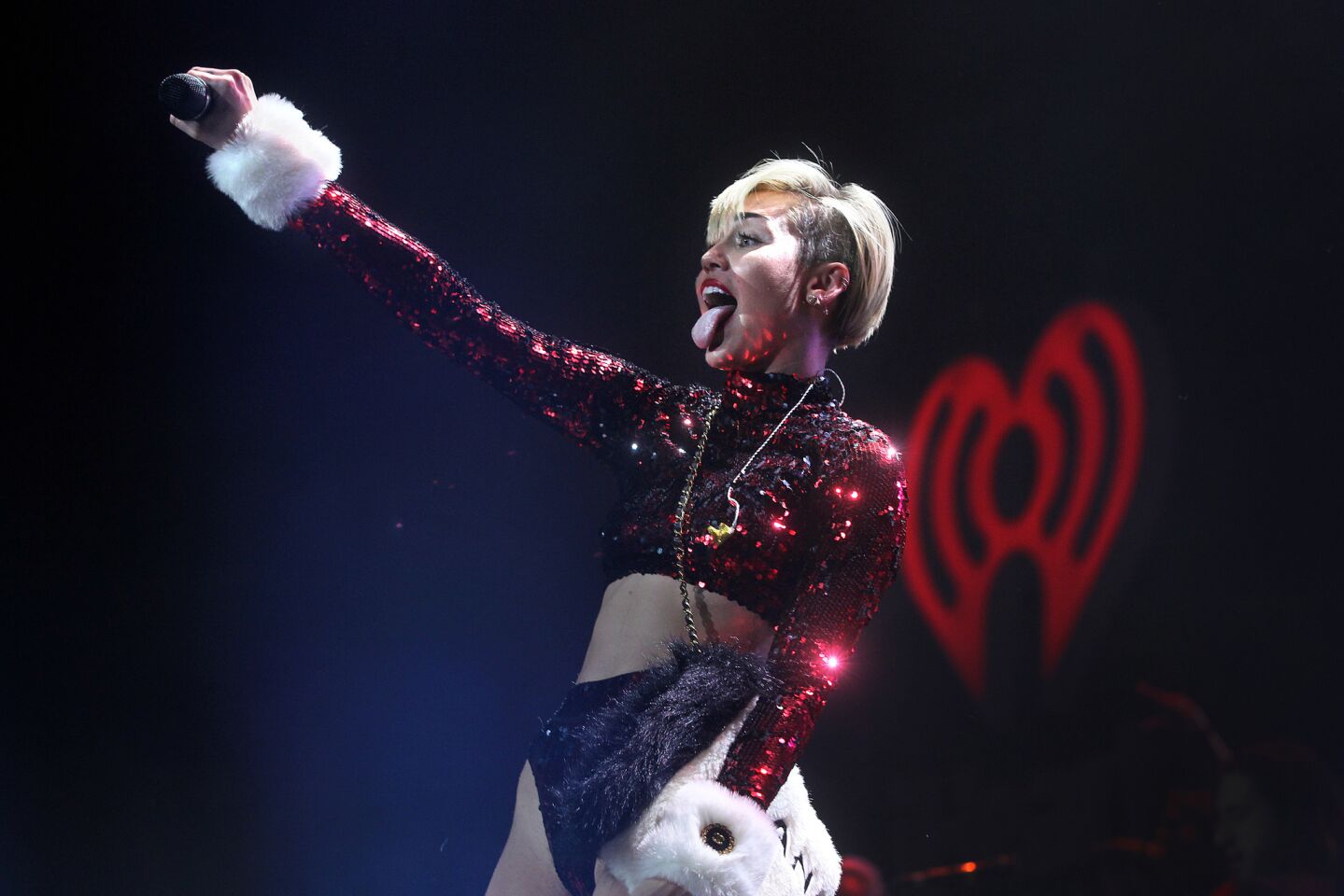 Miley landed on Santa's naughty list the night of her Jingle Ball performance. Well, actually she landed right on Santa when she twerked for him. The tongue-loving musician also managed to lick the Christmas tree. With her powerful vocal chords, Miley rocked the stage with takes on "Party in the U.S.A.," Lana Del Rey's "Summertime Sadness," and "Wrecking Ball."