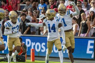 SAN DIEGO, CA - SEPTEMBER 09: UCLA wide receiver Josiah Norwood (14) celebrates his touchdown.