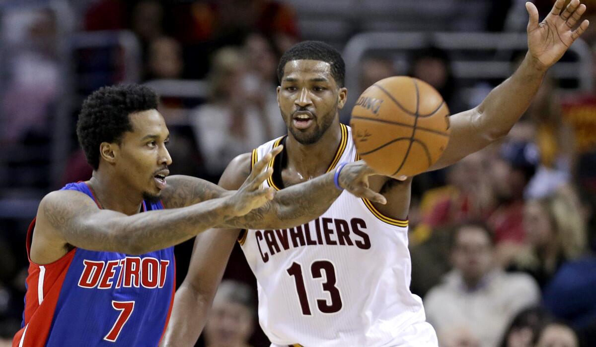 Pistons point guard Brandon Jennings makes a pass around Cavaliers forward Tristan Thompson during a game last season.