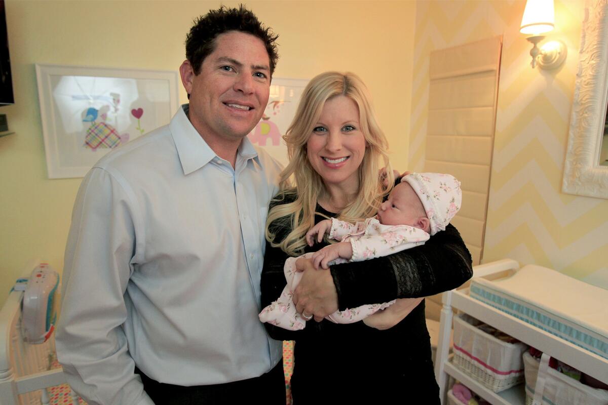 Scott Seal, his wife Kellee and newborn daughter Madelyn in Newport Beach on Wednesday.