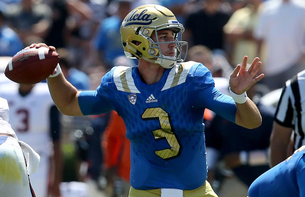 UCLA quarterback Josh Rosen passes downfield against Virginia in the first half Saturday at the Rose Bowl.