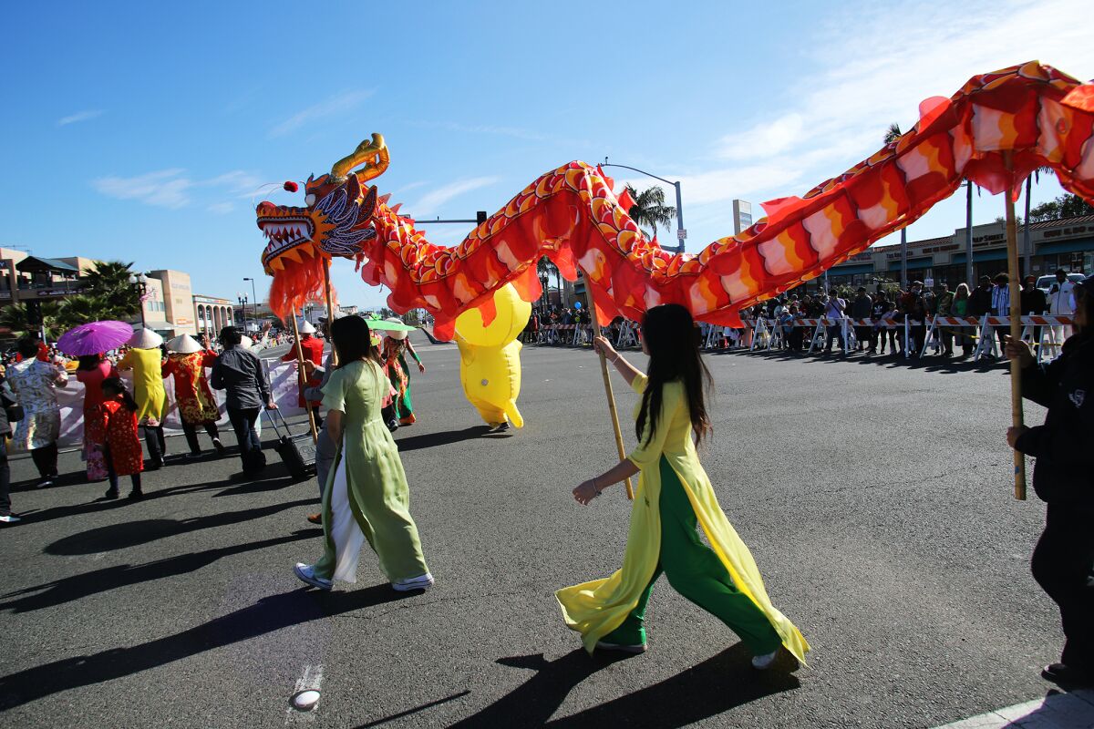 The dragon dance symbolizing "power and nobility" starts the Westminster Tet Parade.