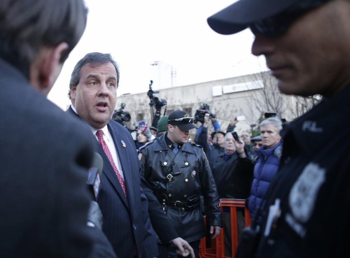 New Jersey Gov. Chris Christie leaves after a visit City Hall in Fort Lee, N.J. on Thursday. Christie traveled to Fort Lee to apologize in person to Mayor Mark Sokolich. Moving quickly to contain a widening political scandal, the governor fired one of his top aides Thursday and apologized repeatedly for the "abject stupidity" of his staff, insisting he had no idea anyone around him had engineered traffic jams to get even with a Democratic mayor.