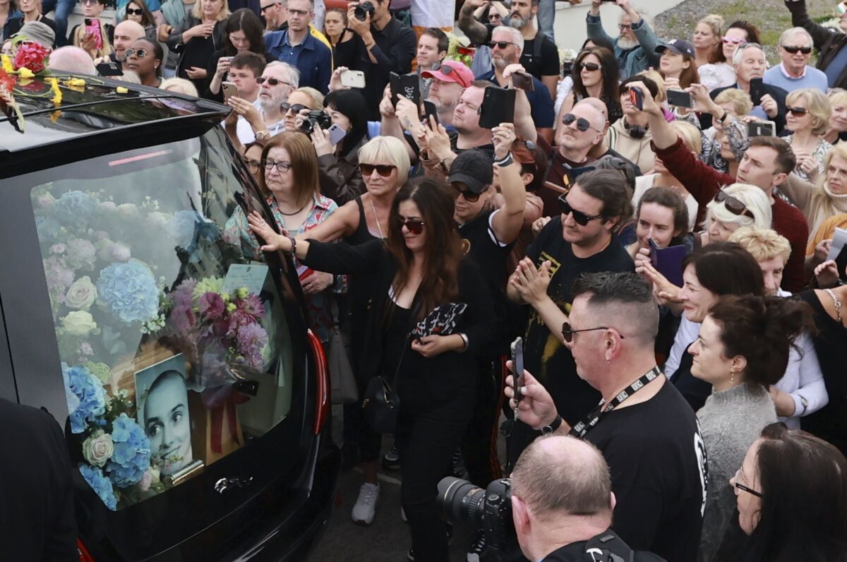 Mourners in Ireland pay their respects to singer Sinéad O'Connor at funeral  procession - The San Diego Union-Tribune