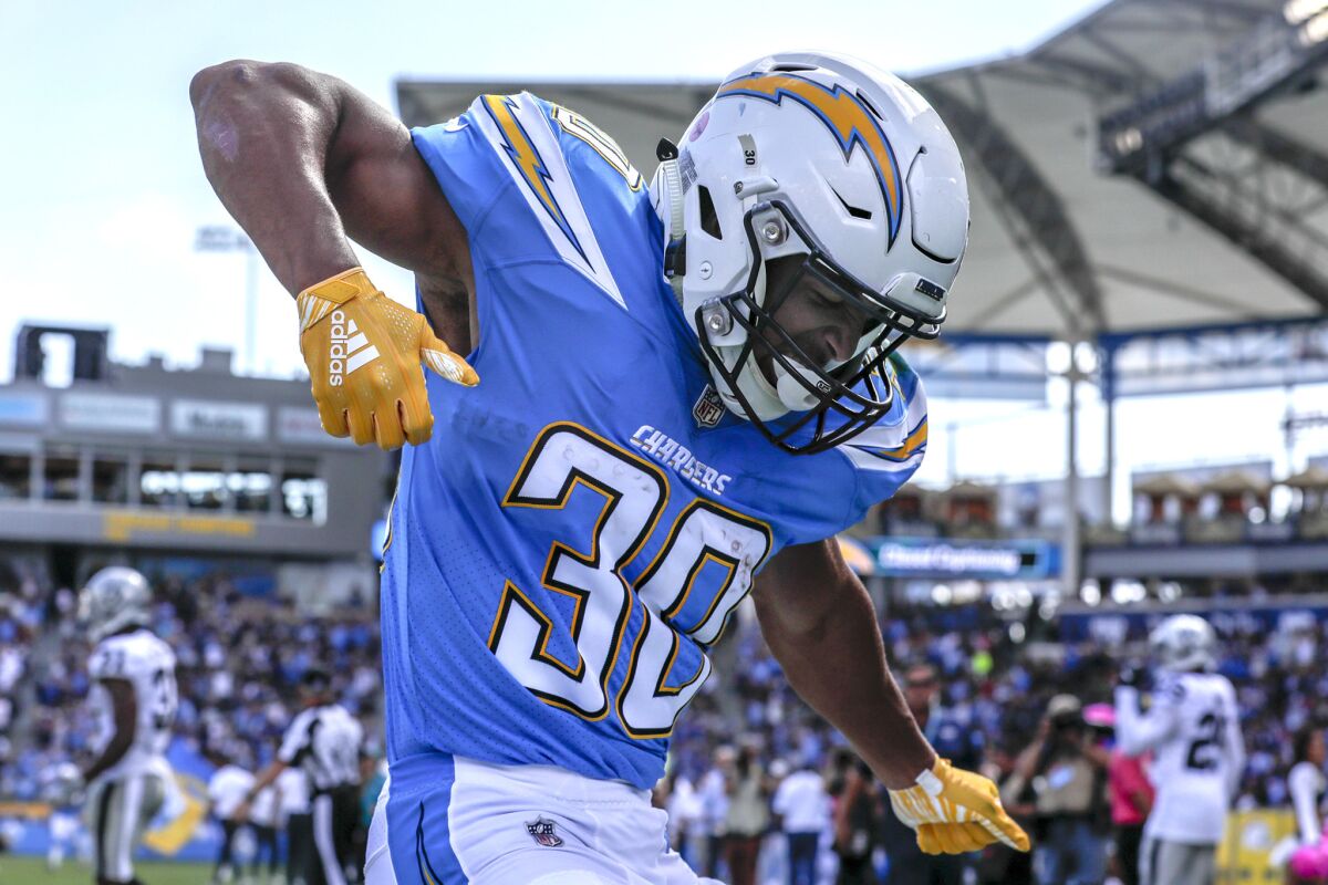 Chargers running back Austin Ekeler dances in the end zone after scoring a touchdown on a 44-yard screen pass from Philip Rivers on Oct. 7, 2018.