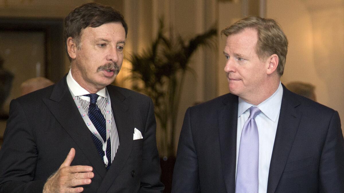 St. Louis Rams owner Stan Kroenke, left, speaks with NFL Commissioner Roger Goodell during a break at an NFL owners' meeting in Washington on Oct. 8, 2013.