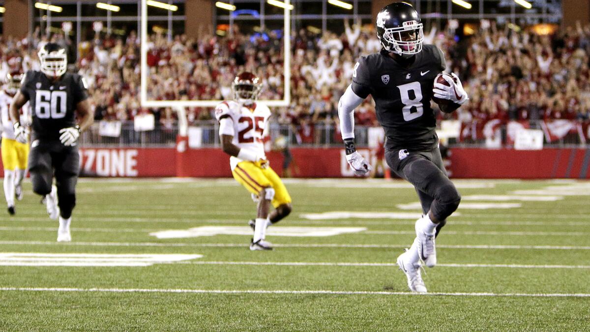Washington State wide receiver Tavares Martin Jr. breaks free for a touchdown in the first half.